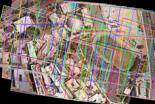 A collection of unmanned aerial vehicle imagery used as input for creation of an orthomosaic. The resulting orthophoto is overlaid with several bounding boxes to show individual image boundaries.